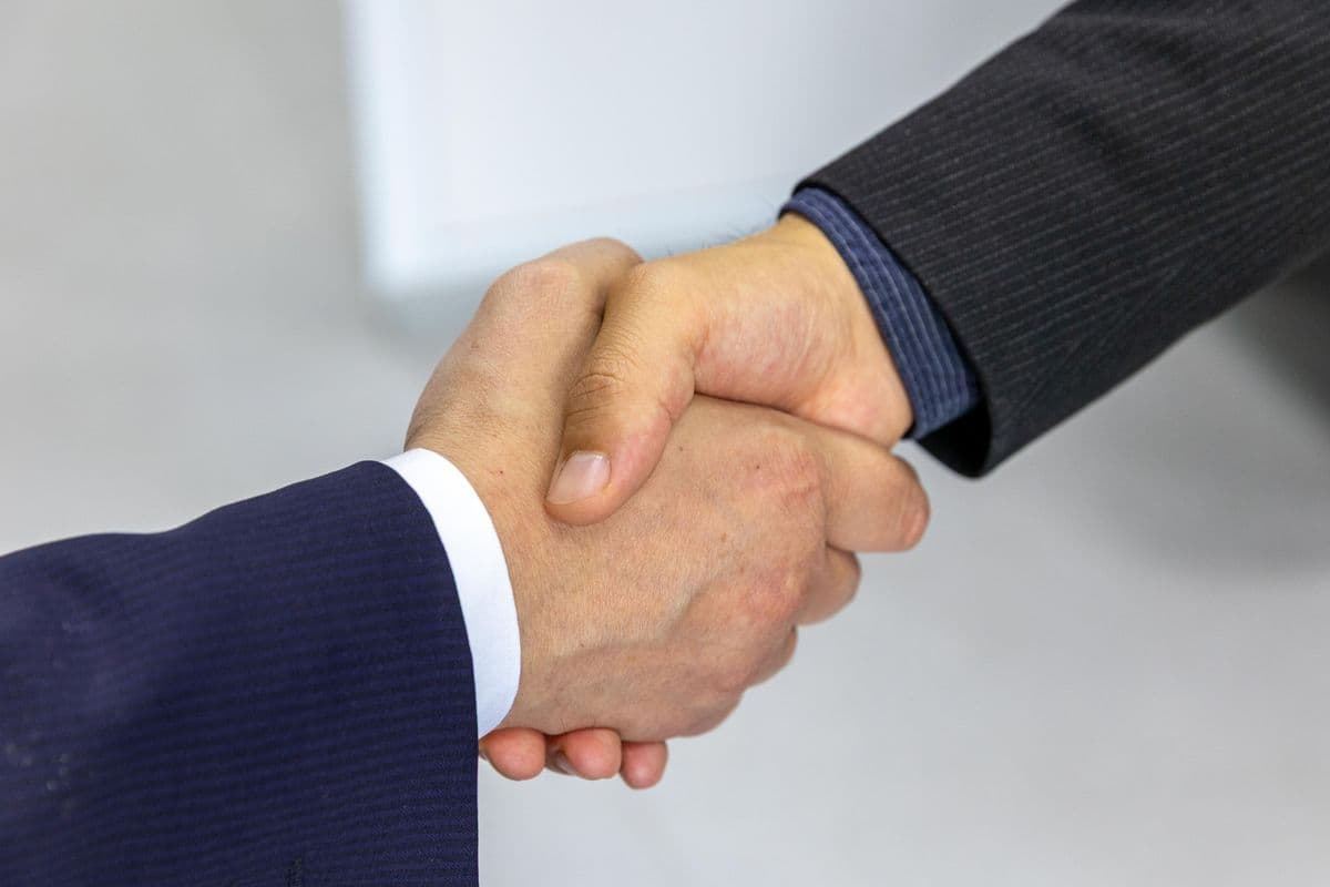 Professional handshake between business partners during a client meeting